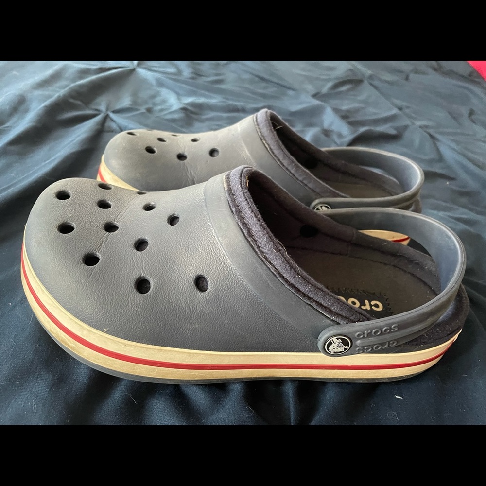 Navy blue lined crocs. Worn a few times, but they are big on my feet